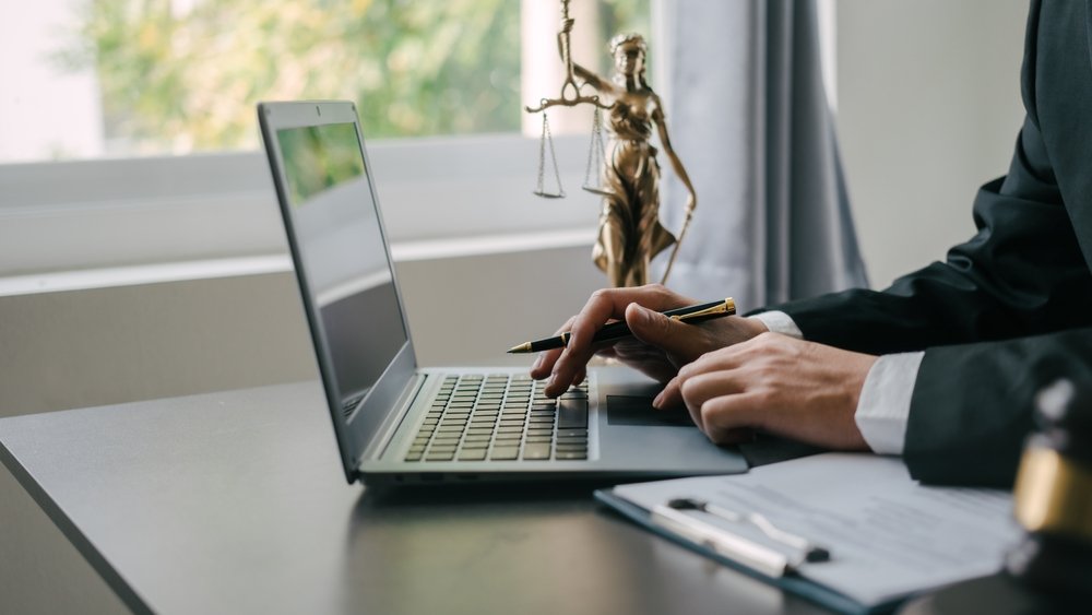 Lawyer reviewing a case on a laptop